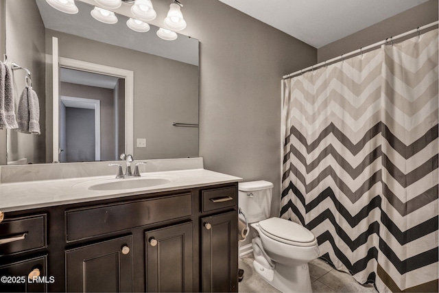 full bath featuring toilet, tile patterned flooring, and vanity