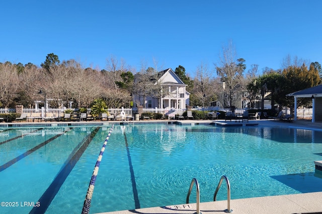 community pool featuring fence