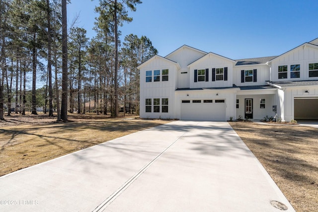 modern farmhouse style home with driveway, an attached garage, and board and batten siding