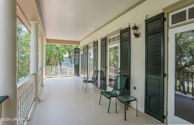 wooden terrace featuring a porch