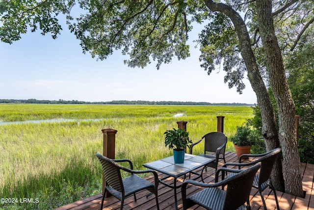 wooden terrace featuring a rural view