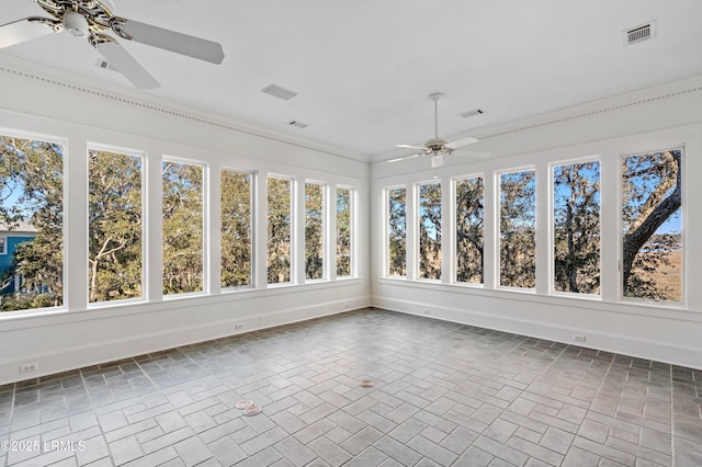 unfurnished sunroom featuring visible vents and ceiling fan