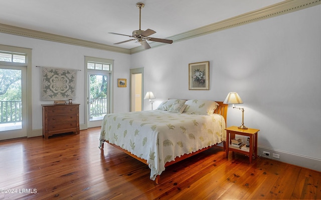 bedroom with dark wood-type flooring, access to outside, ornamental molding, and baseboards