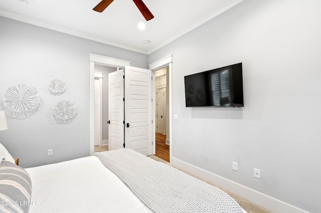 bedroom featuring ceiling fan and ornamental molding