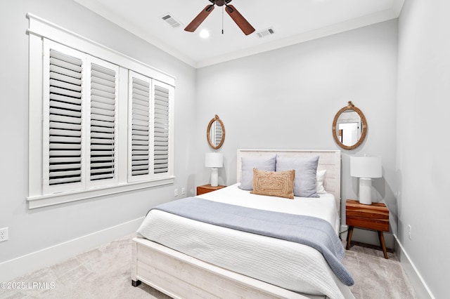 bedroom with ornamental molding, ceiling fan, and carpet