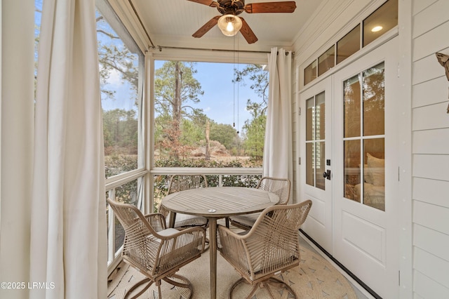 sunroom / solarium with french doors and ceiling fan