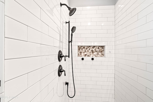 bathroom with a tile shower