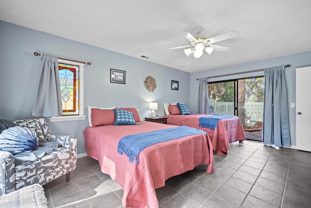 bedroom with tile patterned floors, access to exterior, a ceiling fan, visible vents, and baseboards