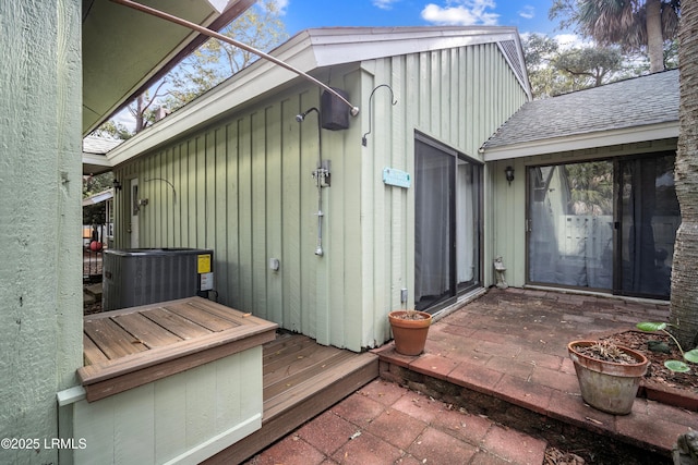 exterior space featuring a deck and central AC unit