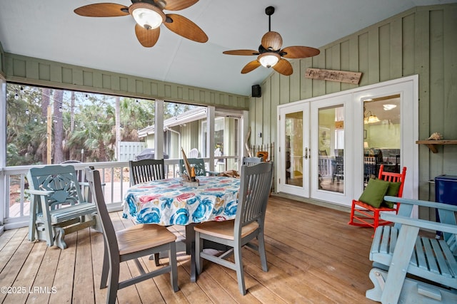 sunroom / solarium featuring ceiling fan and french doors