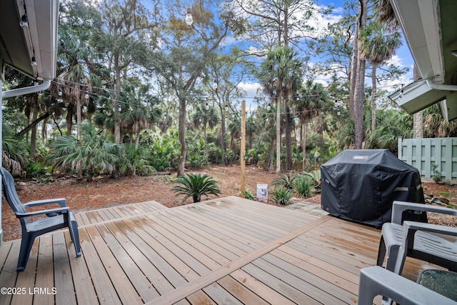 wooden terrace featuring area for grilling