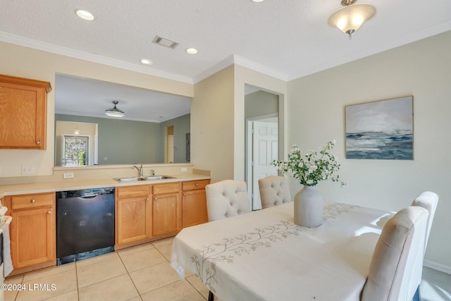 tiled dining space with sink, ornamental molding, and a textured ceiling