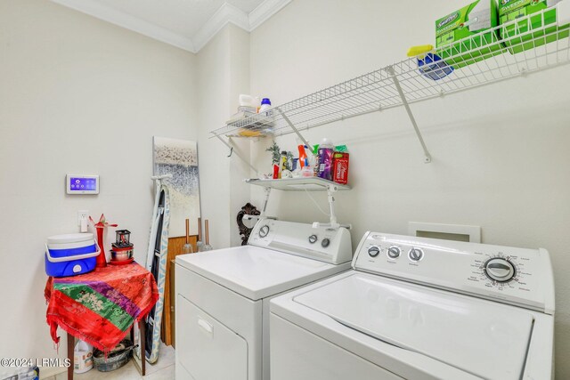 laundry area featuring ornamental molding and independent washer and dryer