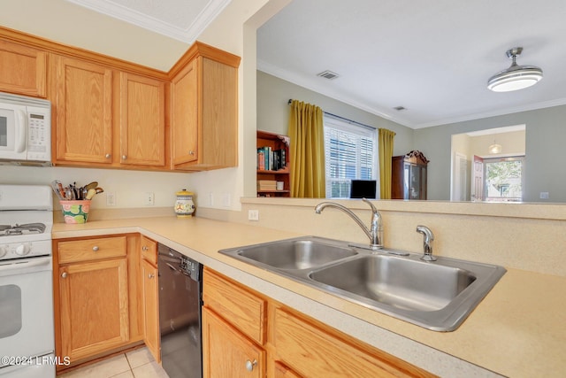 kitchen with crown molding, plenty of natural light, sink, and white appliances