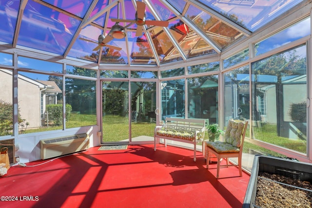 sunroom with a wall mounted air conditioner and ceiling fan