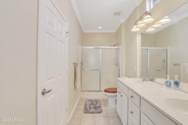 bathroom featuring tile patterned floors, toilet, a textured ceiling, ornamental molding, and a shower with door