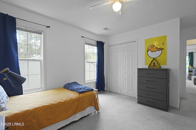 249 Hitching Post Cres, Bluffton, SC 29910 - carpeted bedroom featuring a textured ceiling, a closet, and ceiling fan