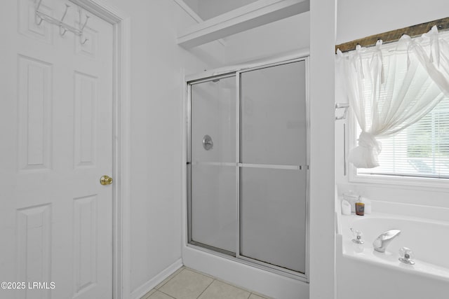 249 Hitching Post Cres, Bluffton, SC 29910 - bathroom featuring a stall shower, a garden tub, tile patterned floors, and baseboards