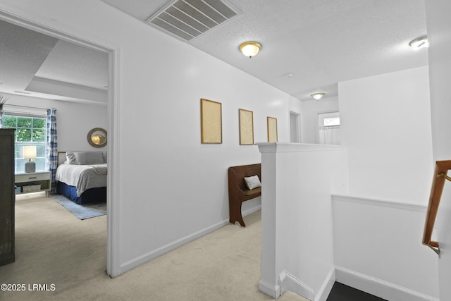 249 Hitching Post Cres, Bluffton, SC 29910 - corridor with carpet, an upstairs landing, baseboards, and a textured ceiling