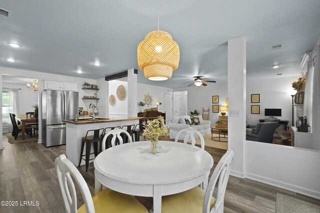 249 Hitching Post Cres, Bluffton, SC 29910 - dining room with dark wood-style flooring, ceiling fan, a chandelier, and recessed lighting