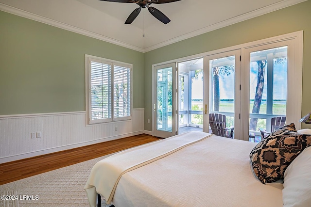 bedroom with hardwood / wood-style flooring, ceiling fan, access to exterior, and crown molding