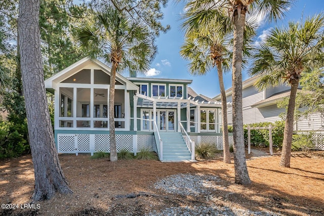 beach home featuring french doors, ceiling fan, and a sunroom