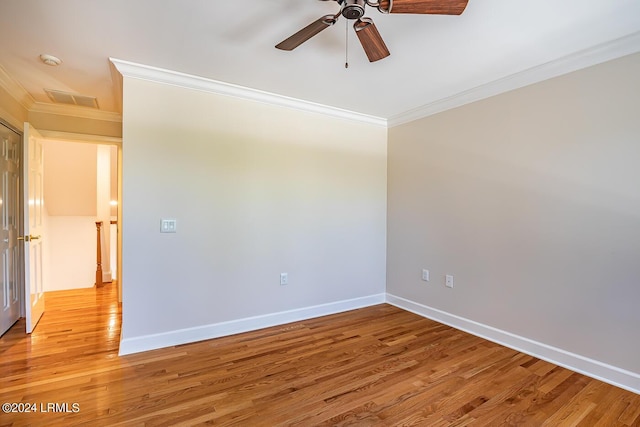 unfurnished room with ornamental molding, ceiling fan, and light hardwood / wood-style floors