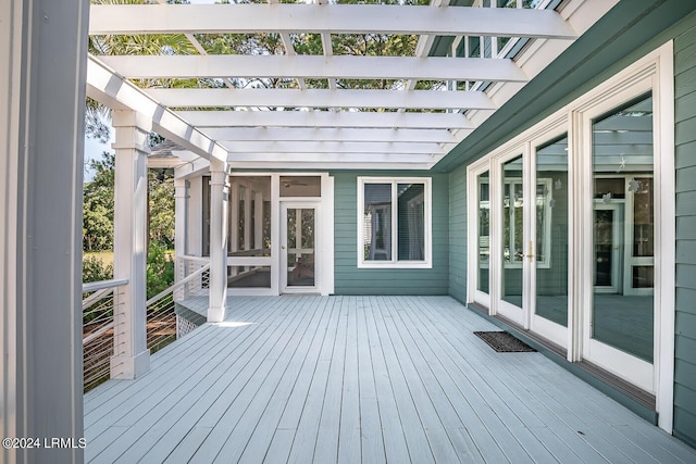 wooden deck with french doors and a pergola