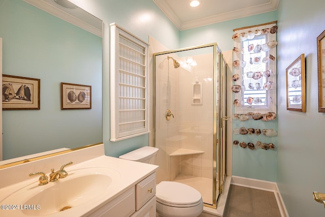 bathroom featuring vanity, ornamental molding, an enclosed shower, and toilet