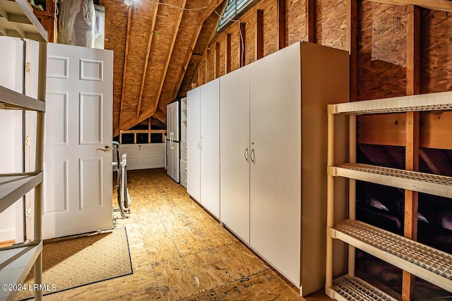 corridor with lofted ceiling