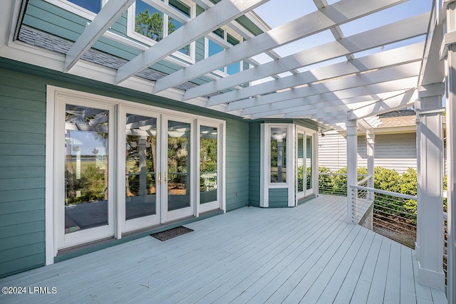 wooden deck with french doors and a pergola