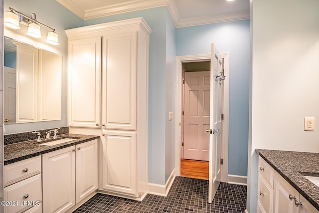 bathroom with ornamental molding, tile patterned floors, and vanity