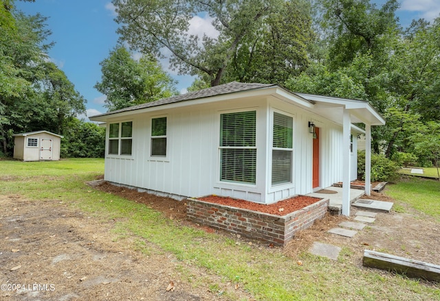 exterior space featuring a shed and a lawn