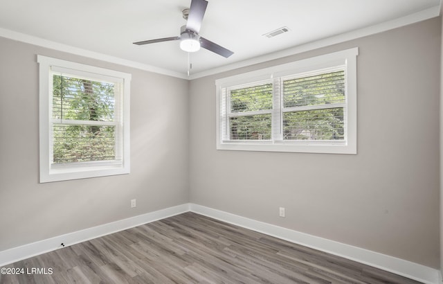 unfurnished room with ornamental molding, wood-type flooring, and ceiling fan