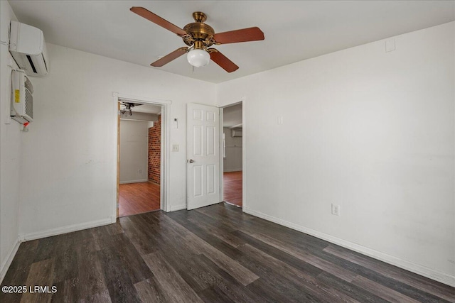 unfurnished bedroom featuring dark wood-type flooring, ceiling fan, and a wall mounted AC