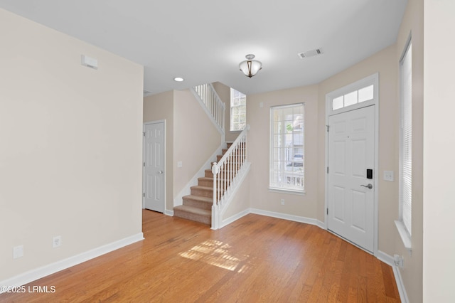 16 Maidencane St, Bluffton, SC 29910 - foyer entrance with stairs, baseboards, and light wood finished floors
