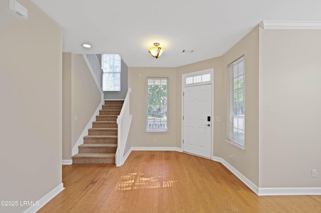 16 Maidencane St, Bluffton, SC 29910 - foyer featuring light wood-style flooring, stairway, and baseboards