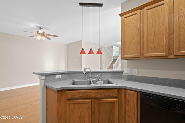 16 Maidencane St, Bluffton, SC 29910 - kitchen with black dishwasher, a sink, a peninsula, a ceiling fan, and brown cabinets