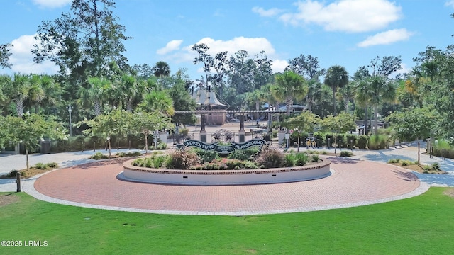 15 S Forest Beach Dr Unit 1D, Hilton Head Island, SC 29928 - surrounding community with a lawn