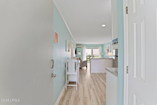 15 S Forest Beach Dr Unit 1D, Hilton Head Island, SC 29928 - hallway with light wood-style floors, ornamental molding, and baseboards