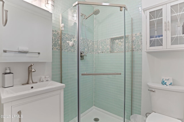 15 S Forest Beach Dr Unit 1D, Hilton Head Island, SC 29928 - bathroom featuring a stall shower, toilet, and a sink
