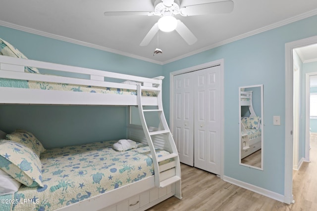 15 S Forest Beach Dr Unit 1D, Hilton Head Island, SC 29928 - bedroom featuring light wood finished floors, crown molding, a closet, baseboards, and a ceiling fan