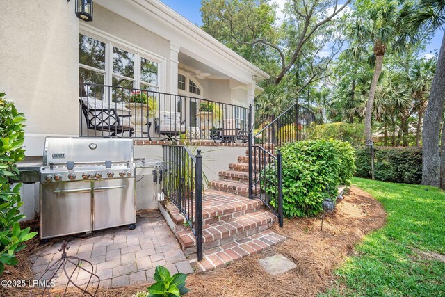 71 Peninsula Dr, Hilton Head Island, SC 29926 - property entrance with covered porch and stucco siding