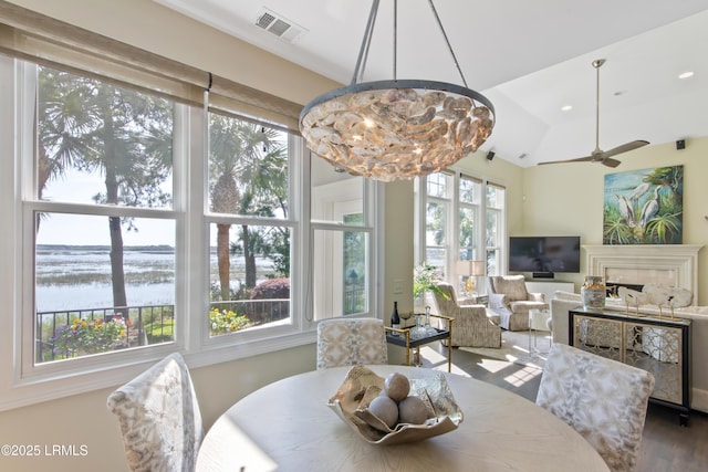 71 Peninsula Dr, Hilton Head Island, SC 29926 - dining space with a water view, ceiling fan, and wood finished floors