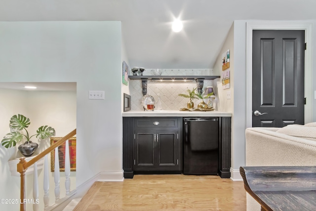 71 Peninsula Dr, Hilton Head Island, SC 29926 - indoor dry bar featuring fridge, tasteful backsplash, and light wood-style flooring