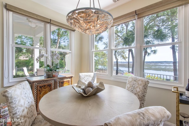 71 Peninsula Dr, Hilton Head Island, SC 29926 - dining room with a water view, plenty of natural light, and a chandelier