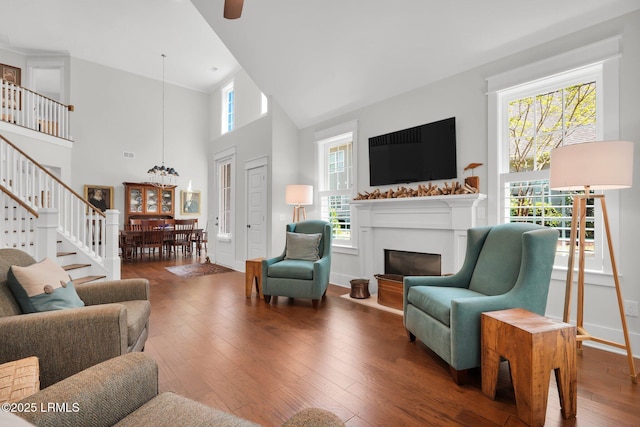 33 Paxton Cir, Bluffton, SC 29910 - living room featuring a wealth of natural light, stairs, a glass covered fireplace, and hardwood / wood-style floors