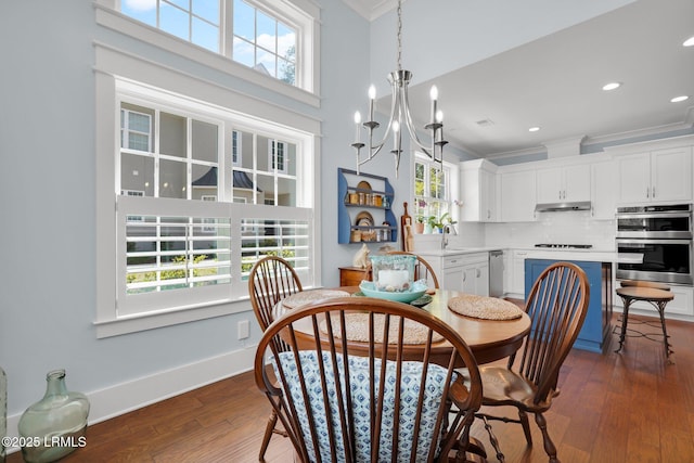 33 Paxton Cir, Bluffton, SC 29910 - dining room featuring a notable chandelier, dark wood-style flooring, baseboards, and crown molding