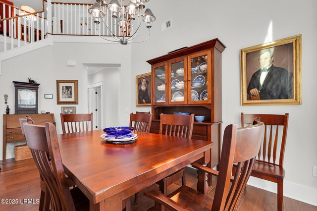 33 Paxton Cir, Bluffton, SC 29910 - dining area with dark wood-type flooring, baseboards, a notable chandelier, and visible vents