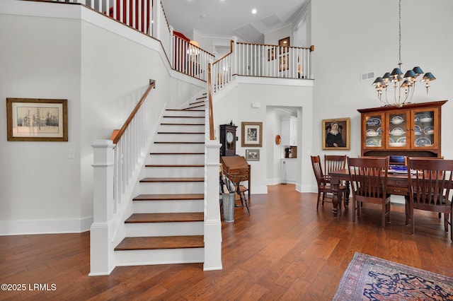 33 Paxton Cir, Bluffton, SC 29910 - staircase featuring visible vents, baseboards, a notable chandelier, and hardwood / wood-style flooring